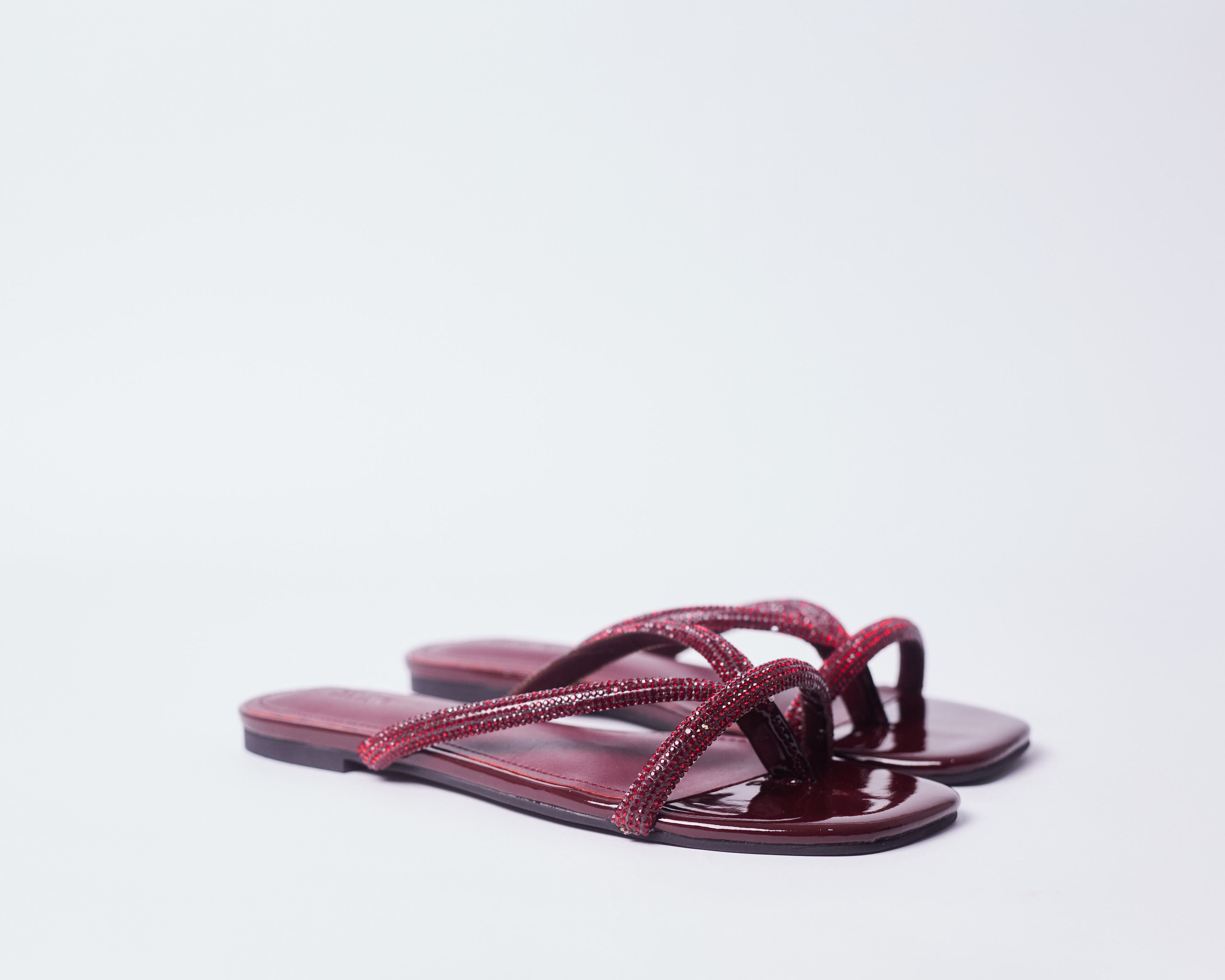EYRAM- Dark red inspired slippers for ladies.
Very comfortable and stylish and sparkly featuring crystal accessories.
Can be worn for picnics, vacations, lunch and casual hangouts. Shipping worldwide from Ghana to UK, USA, Africa etc.