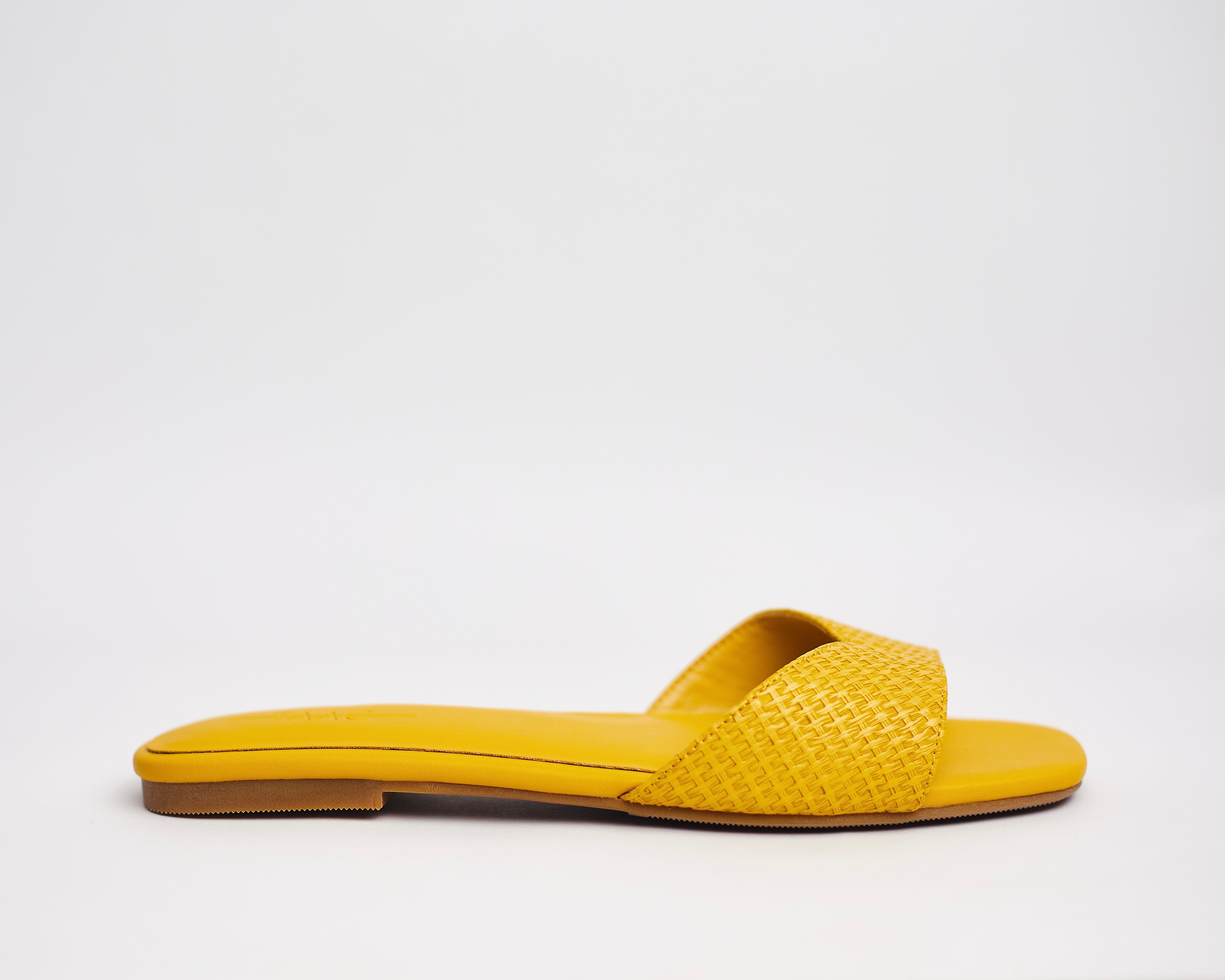 MALIKA-Mustard coloured comfortable woven-effect slipppers for ladies.Very durable, made with high quality sole. Perfect for brunch, lunch, errands etc. shipping worldwide from Ghana to UK, USA, Africa etc.