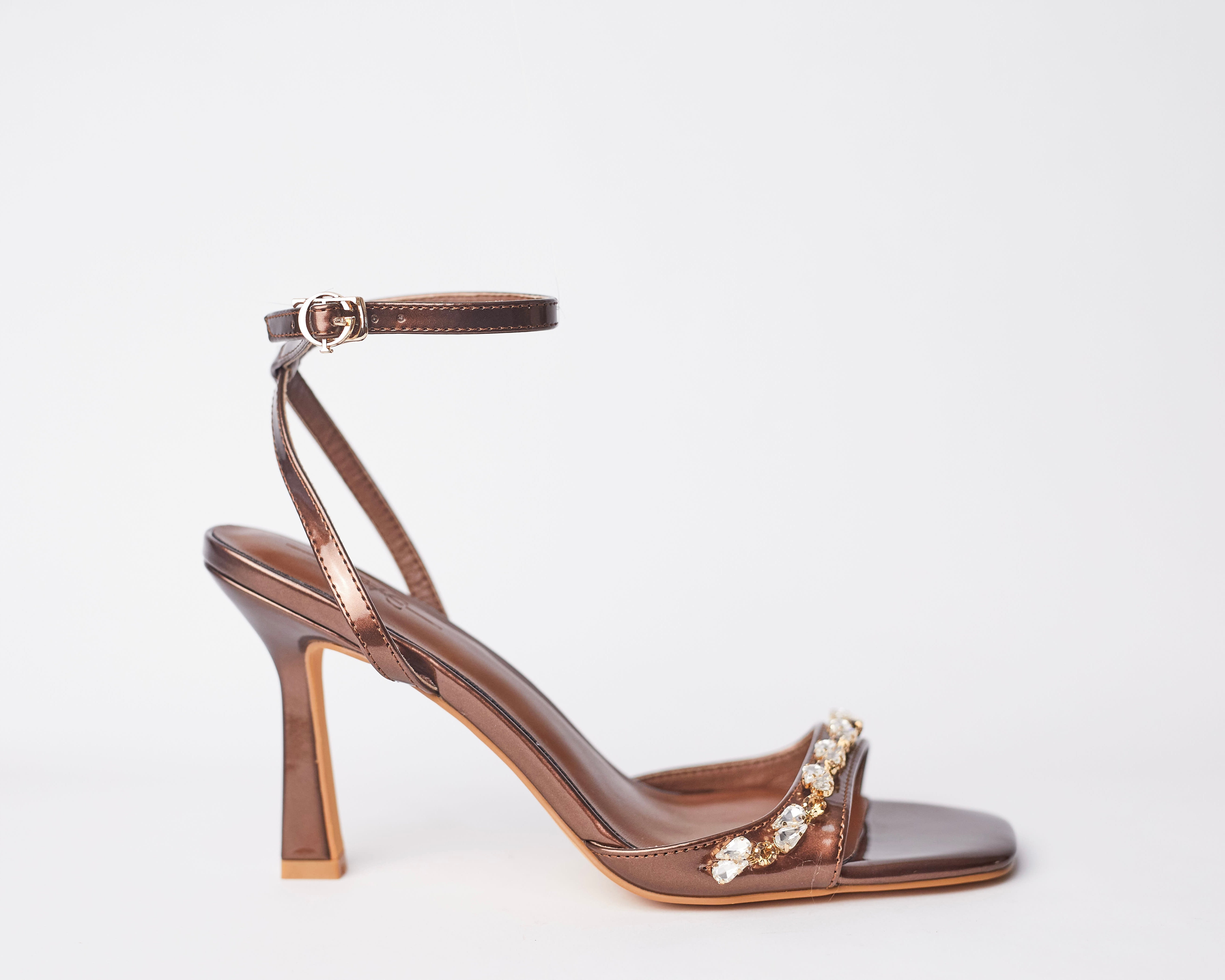 AMOKUA - bronze classy sandal heels. Very stylish, has crystal accessories. Perfect for parties, classy girls night out and celebrations. Shipping worldwide from Ghana to UK, USA, AFRICA ETC.
