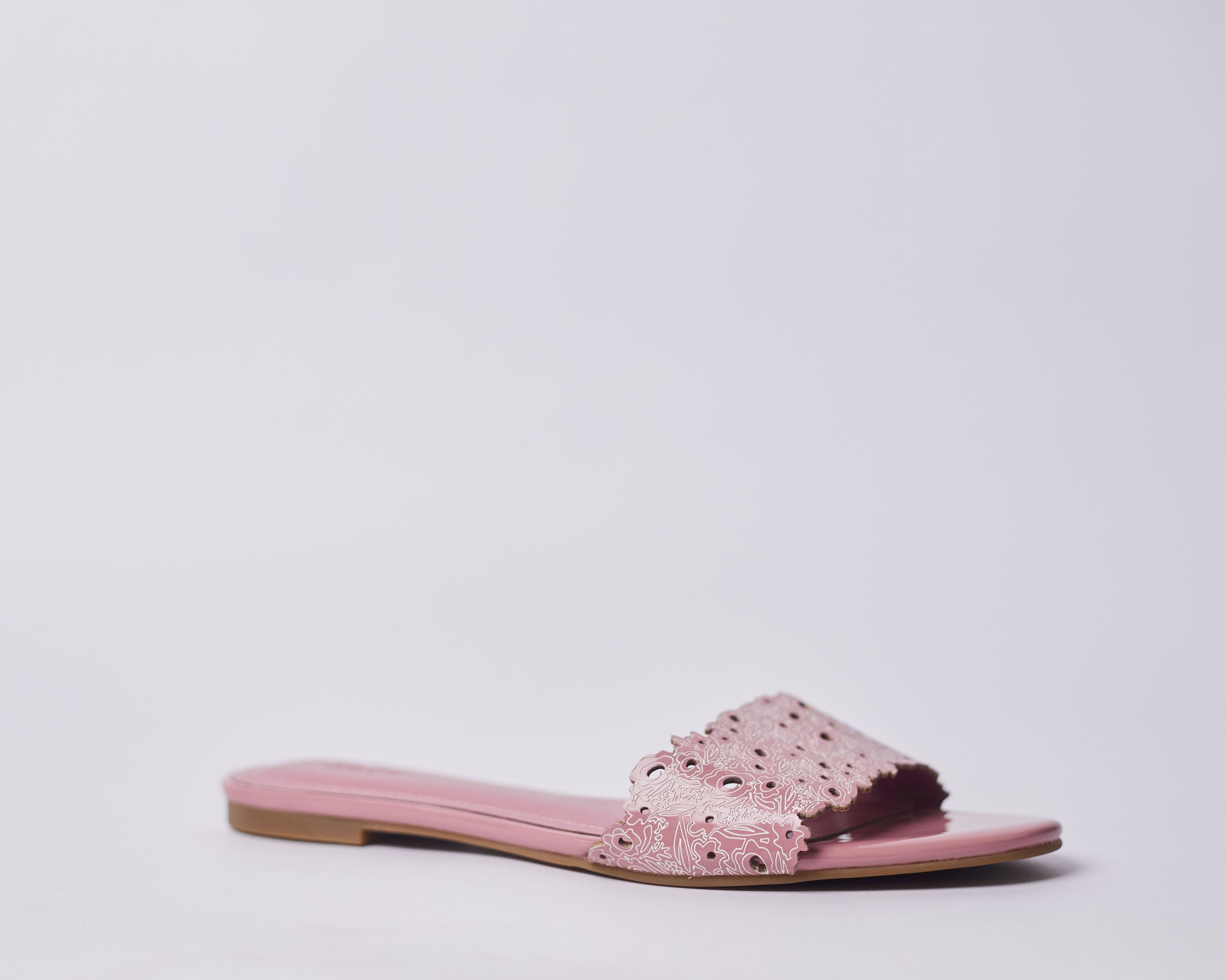 LAMISI - Floral inspired slippers for ladies. Very stylish,featuring a laser-cut upper. Can be worn for vacation, lunch and casual hangouts. Shipping worldwide from Ghana to UK, USA, Africa etc