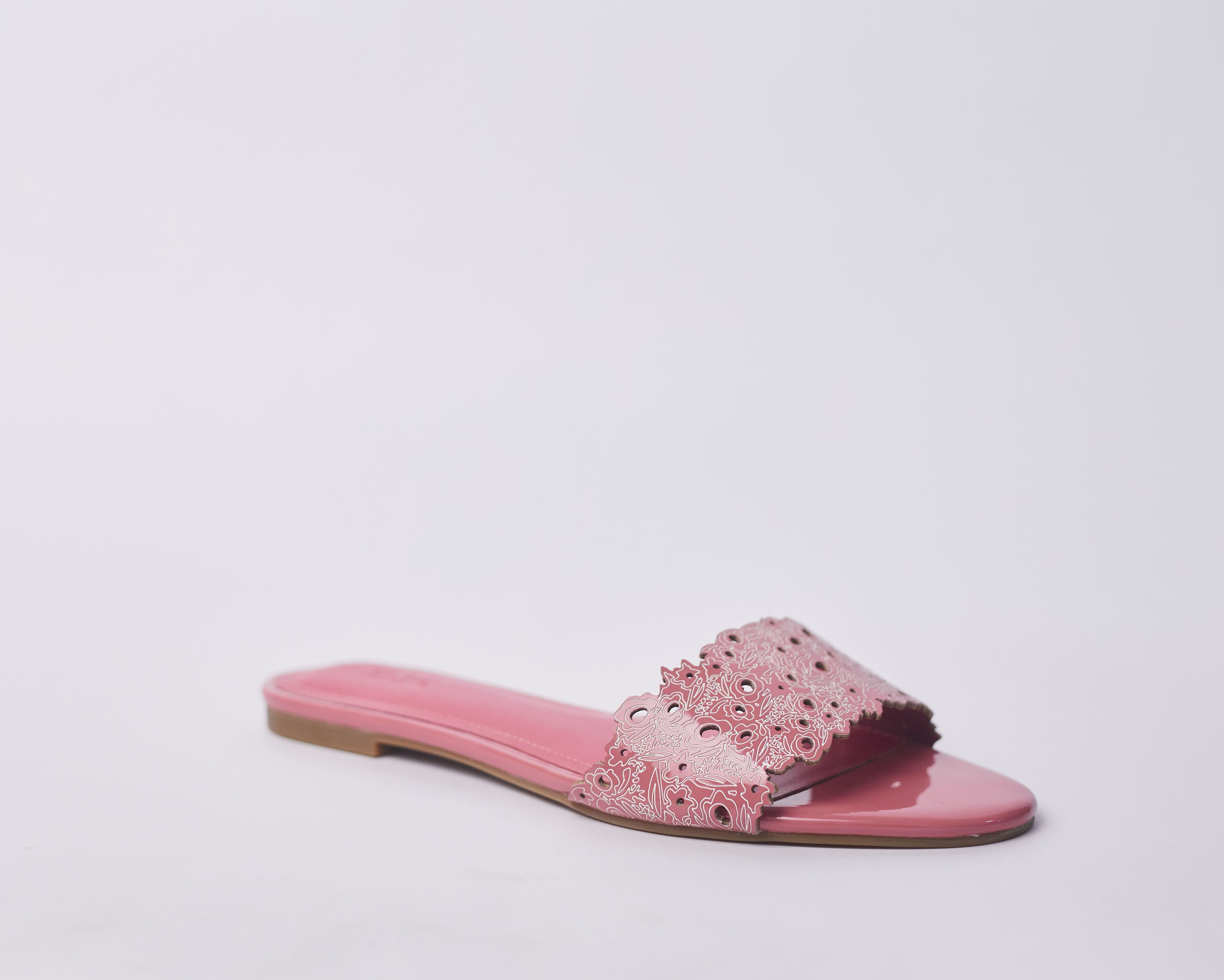 LAMISI - Floral inspired slippers for ladies. Very stylish,featuring a laser-cut upper. Can be worn for vacation, lunch and casual hangouts. Shipping worldwide from Ghana to UK, USA, Africa etc