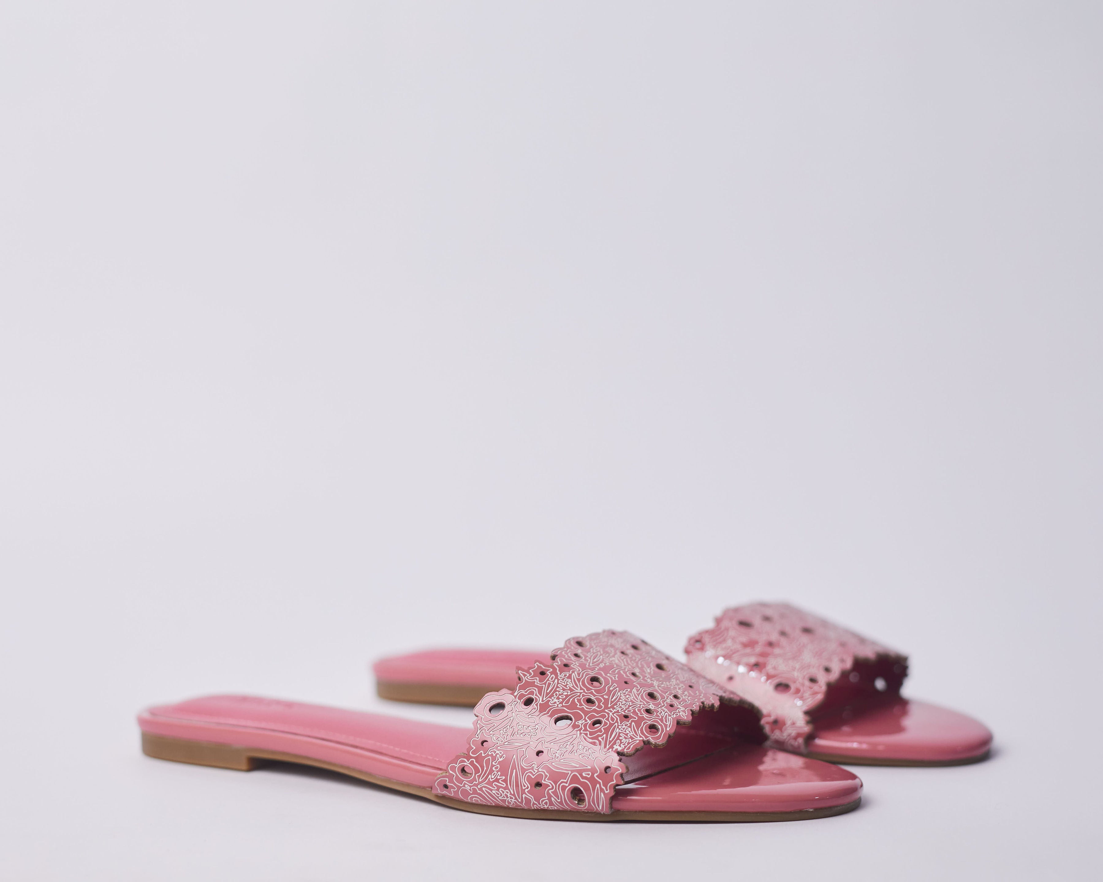 LAMISI - Floral inspired slippers for ladies. Very stylish,featuring a laser-cut upper. Can be worn for vacation, lunch and casual hangouts. Shipping worldwide from Ghana to UK, USA, Africa etc
